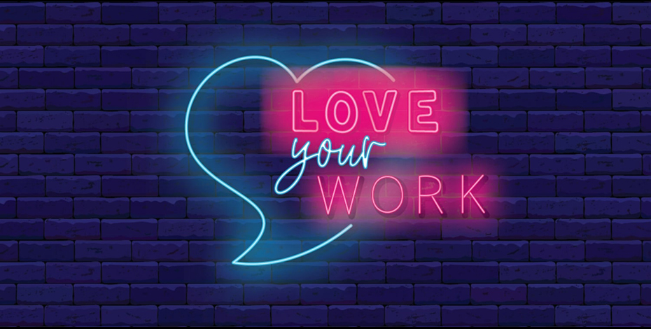 A neon sign says 'love your work' inside a heart. 