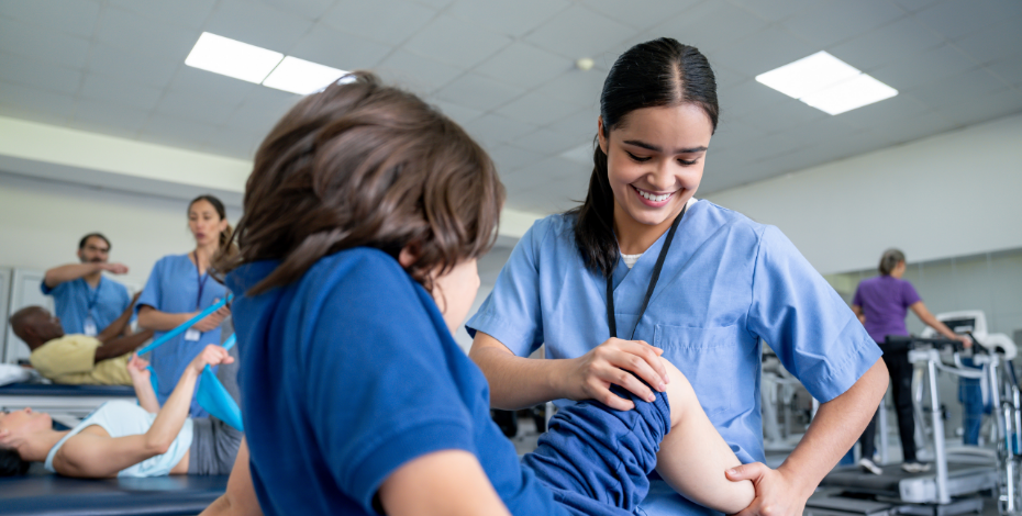 A physiotherapist treating a child in hospital 