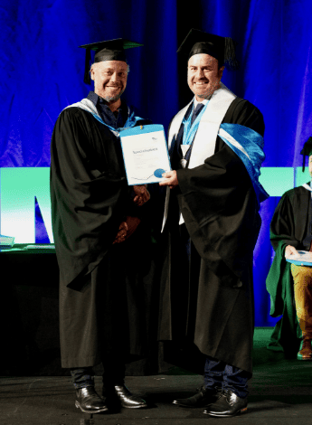 Jon Ford is awarded his pain specialisation at the APA IGNITE conference in Brisbane in 2023.