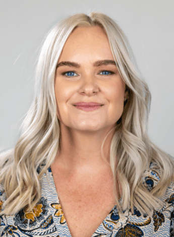 The image is of Angela Grey, a physiotherapist and lifestyle medicine practitioner. She has long blonde hair. 