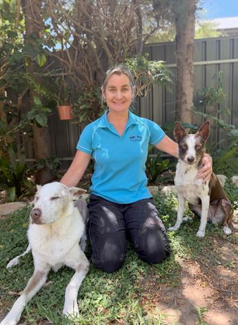 Photo of Emma Kirby and her dogs 