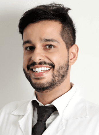 A Hispanic man with a short beard