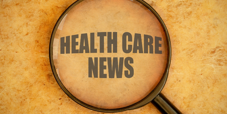 Magnifying glass on a yellow speckled background with the text health care news