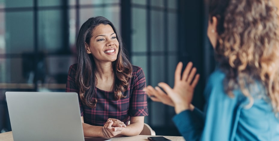 Two business women conduct an interview.