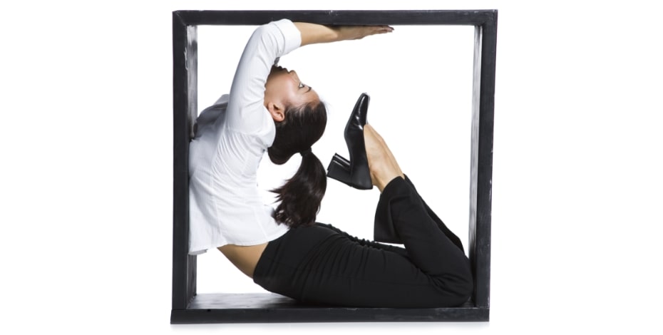 A woman curls backwards very flexibly within a black square.