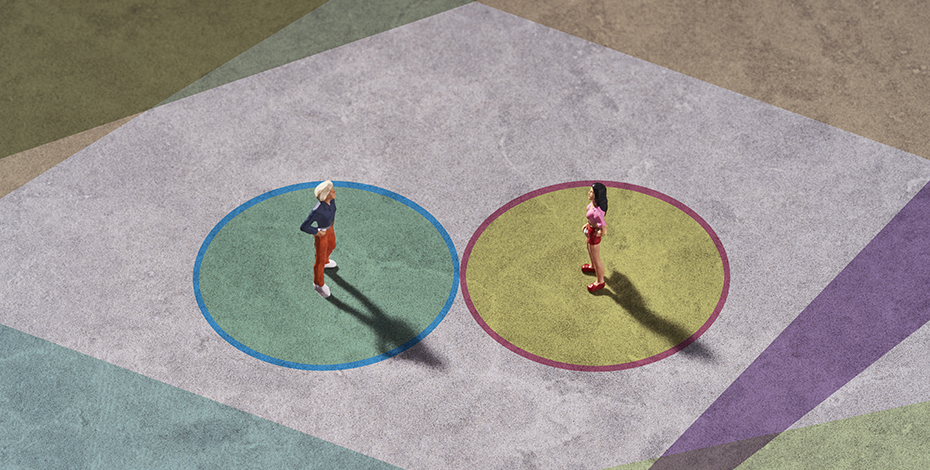 Two people each standing in a coloured circle are facing each other.