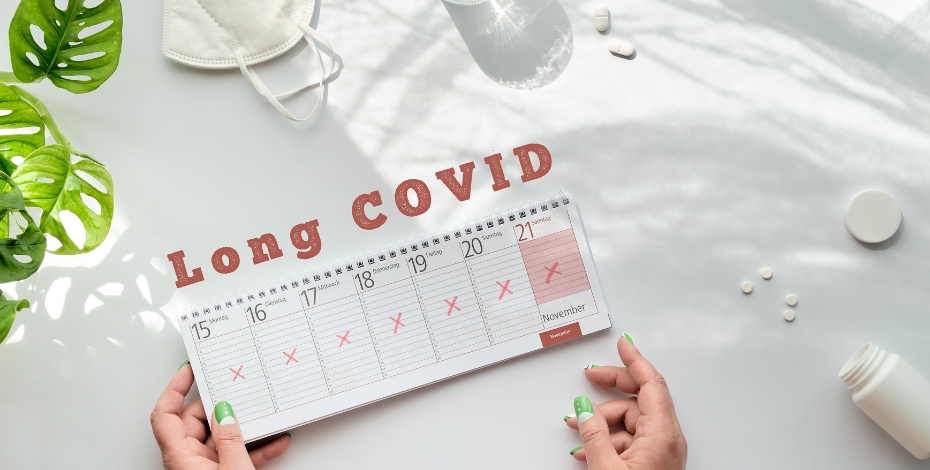 hands holding a calendar and sign above that says long covid