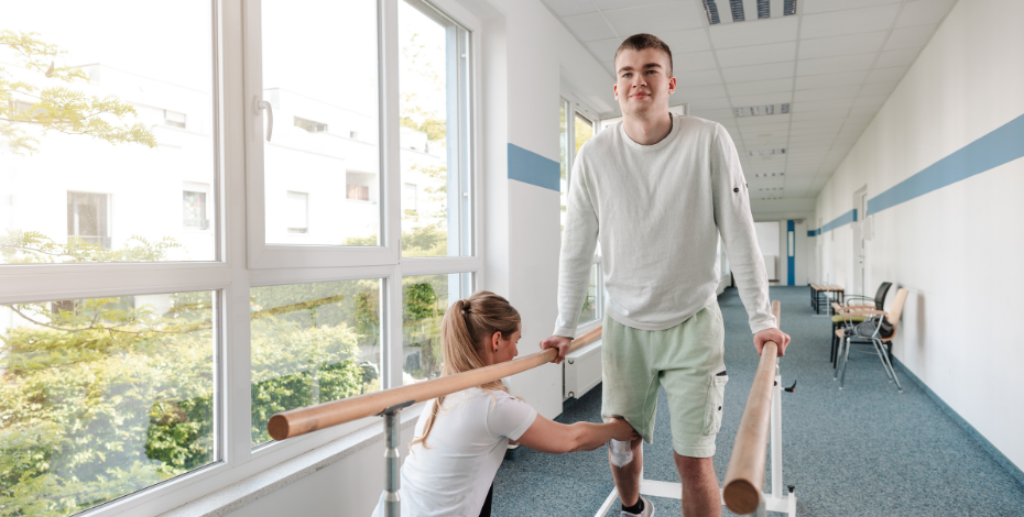 Physiotherapy patient completes rehab using walking rails in a clinic.
