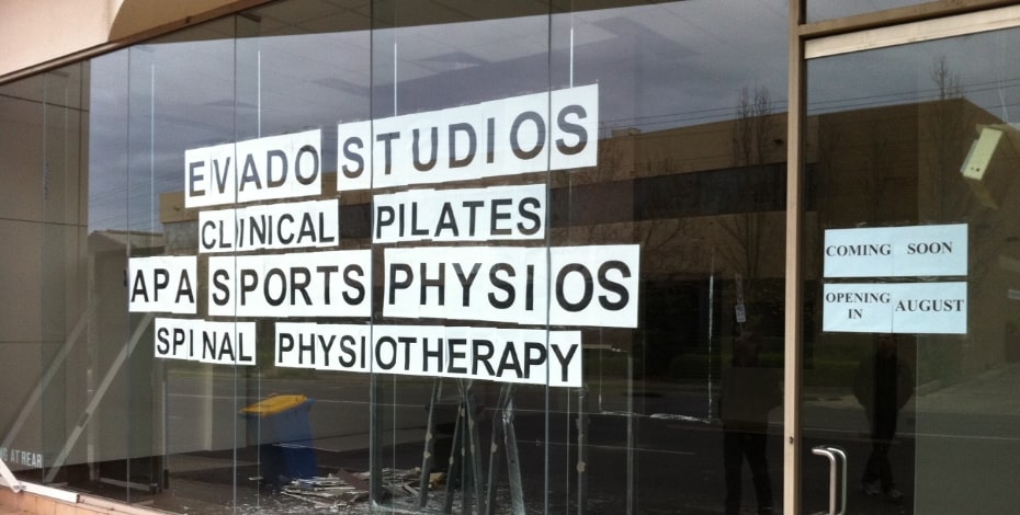 The window of an Evado practice about to open for business.