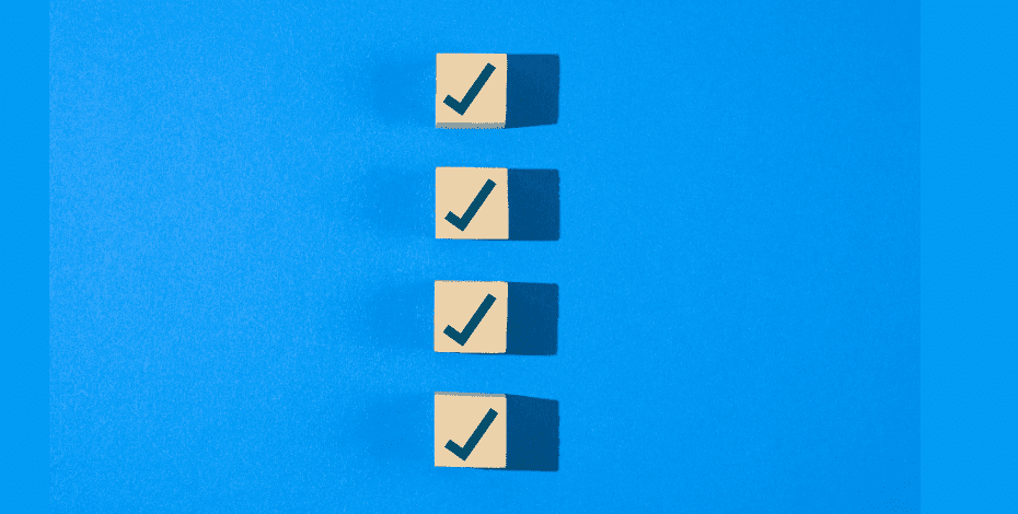 Four vertical check boxes in a row underneath one another, against a blue background.