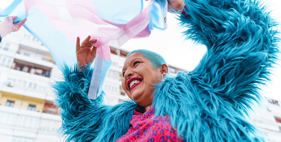 An individual waving the trans flag