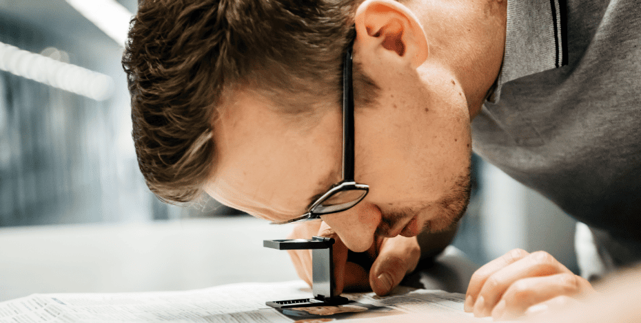 Doctor looking through a magnifying glass