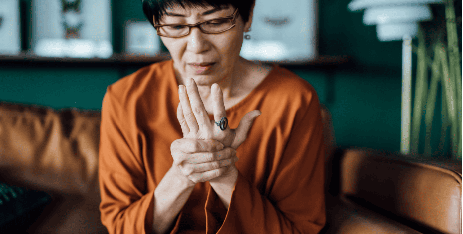 A woman holding her wrist in pain