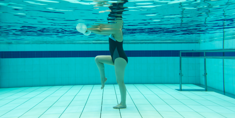 A woman doing hydrotherapy exercises in a pool 