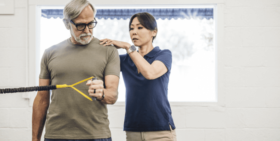 Female physiotherapist helping a patient. 