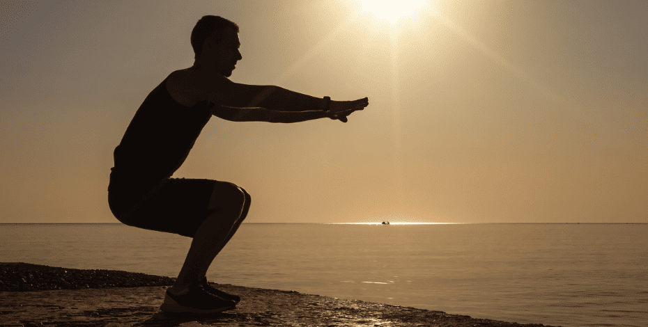 Person exercising on the beach