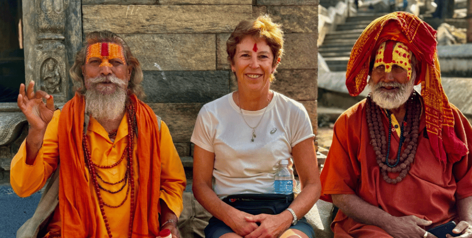 Judith with some holy men in Nepal during her recent trip there.
