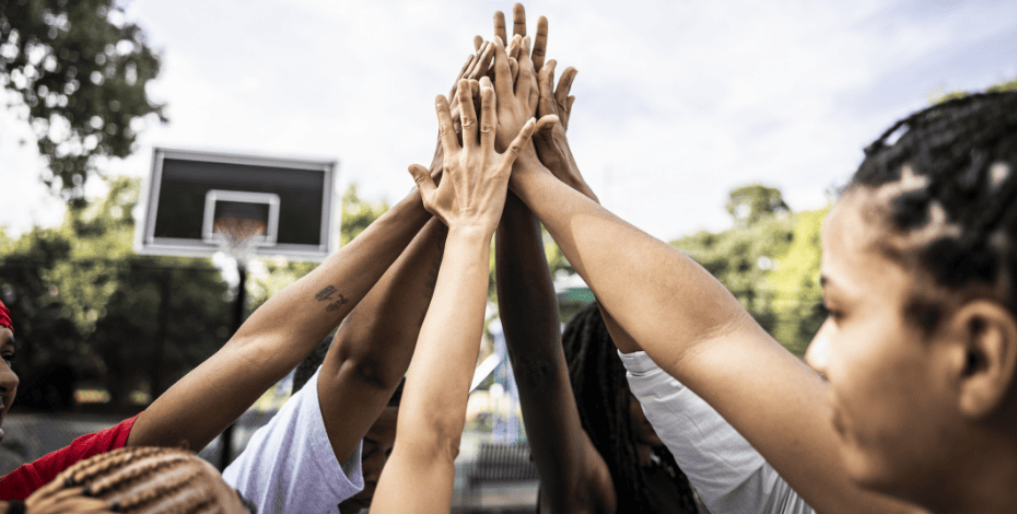 A group of people bringing their hands together