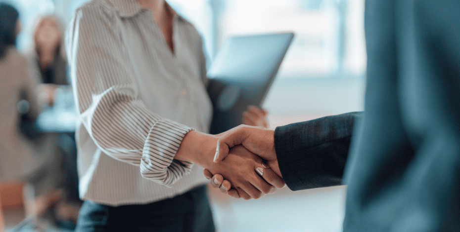Two people are shaking hands as if in agreement with each other, a shared decision has been reached.