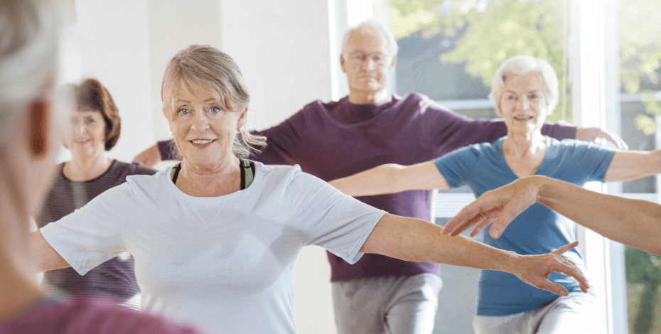 The image is of a group of older men and women doing a group exercise class