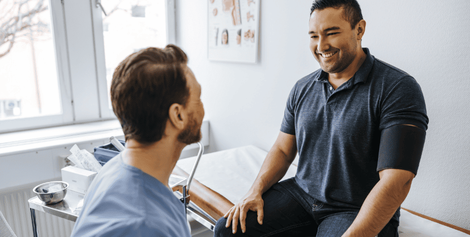 A physiotherapist and patient are having a discussion about pain.