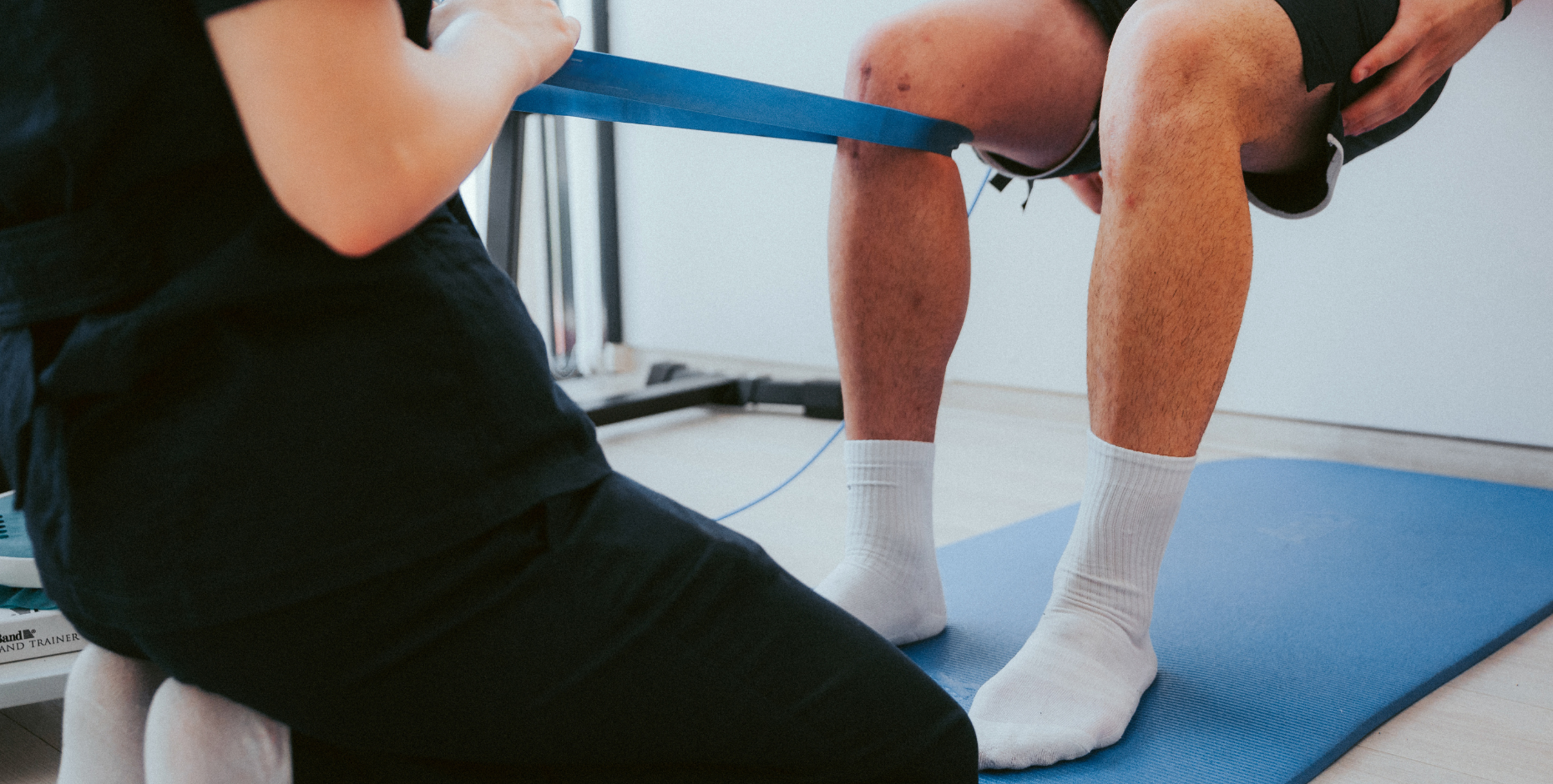 Physiotherapist working on knee strength