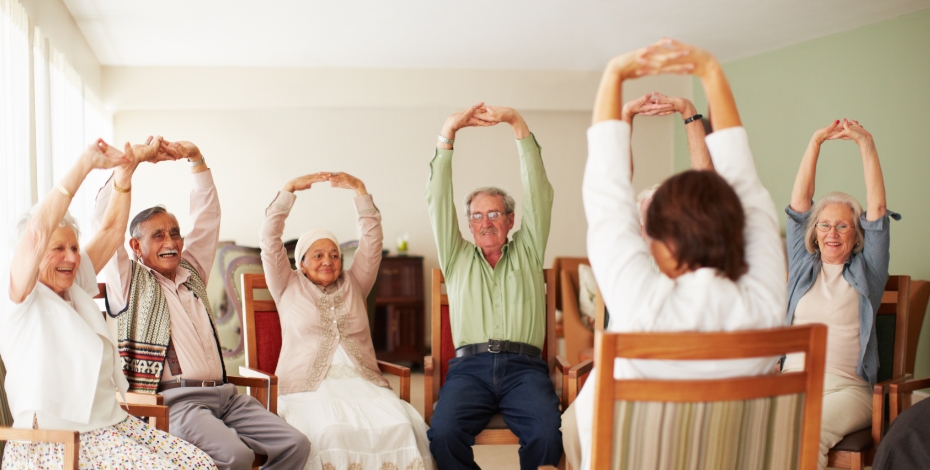 Elderly people doing an exercise class