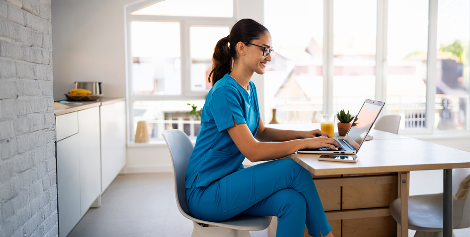 Physiotherapist using a laptop