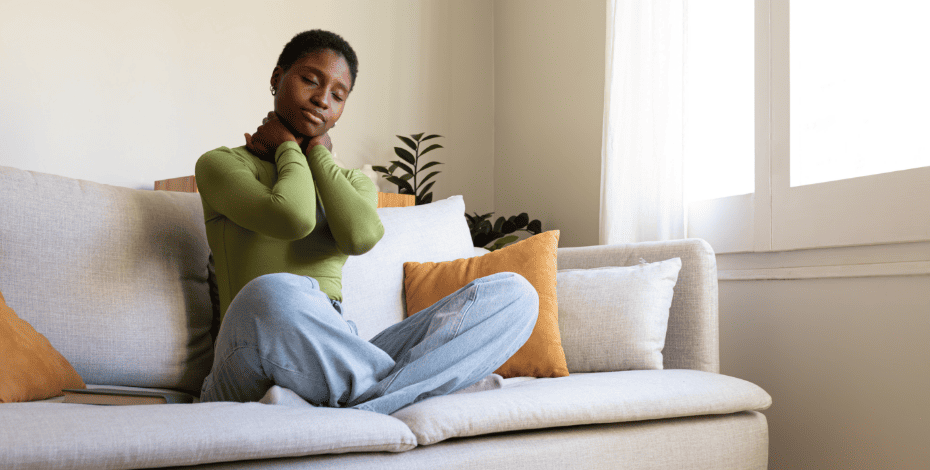 Woman clutching her neck in pain