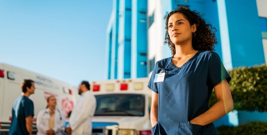 A clinician stares off into the distance to signify an advanced scope practitioner. 