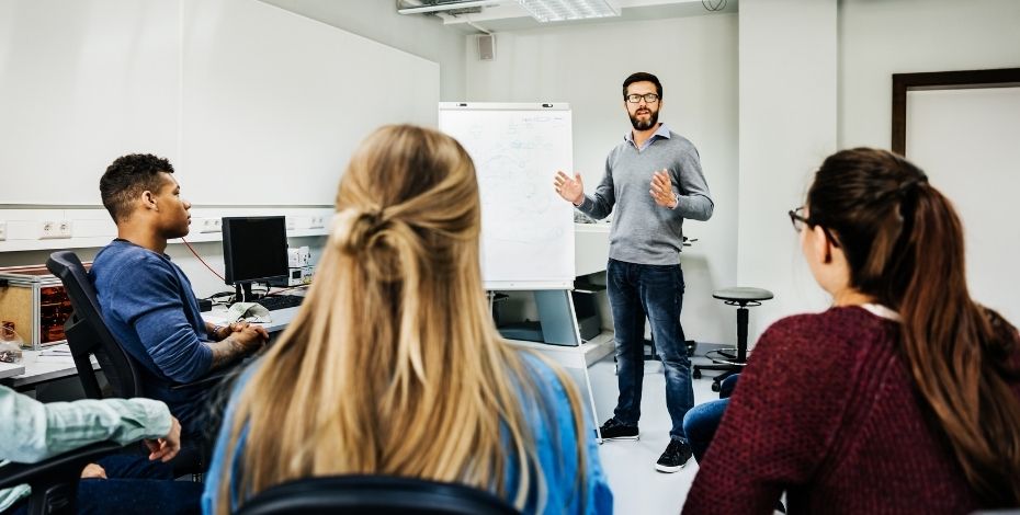 A teacher presenting a class to students