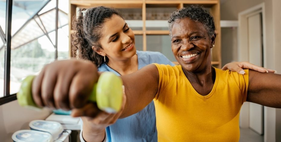 A physio working with an older client