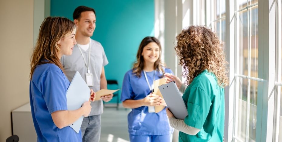 Allied health workers mentoring more junior colleagues.