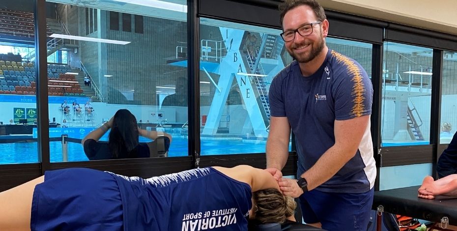 Andrew Cameron treats diver Laura Hingston at the 2023 Australian Diving Grand Prix in Brisbane.