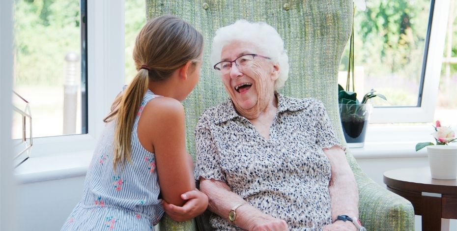 Older lady speaking with a young girl