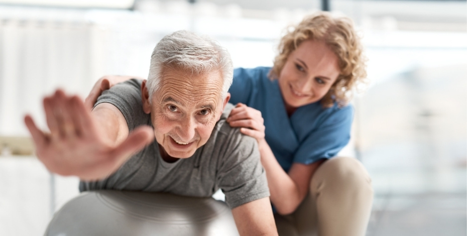 A physiotherapist works with an older patient on balance. 