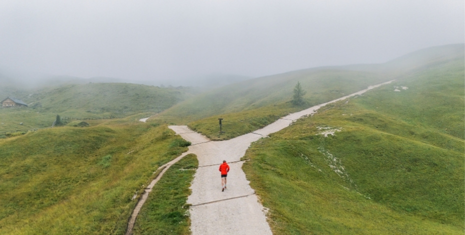 A person facing two different paths to show a choice in a career. 