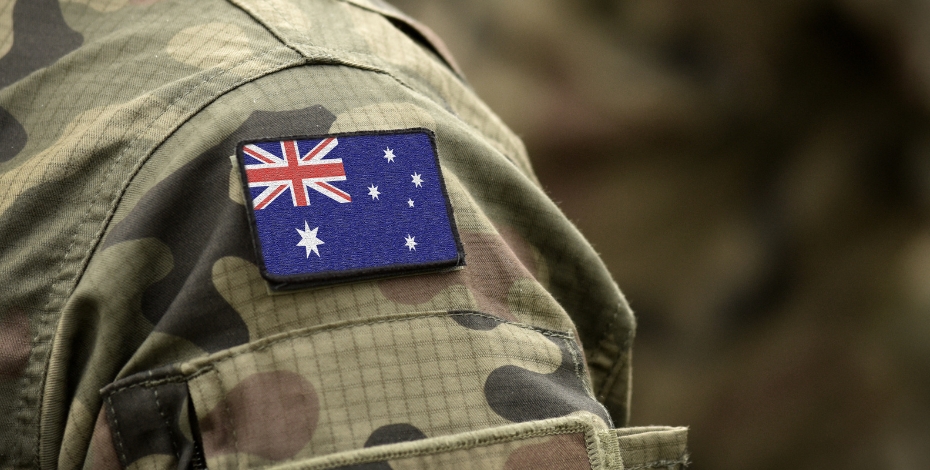 Person with camo and Australian flag on sleeve