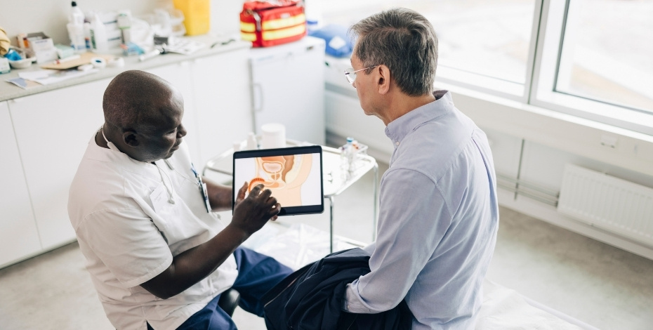 A health practitioner talking to a patient about prostate cancer