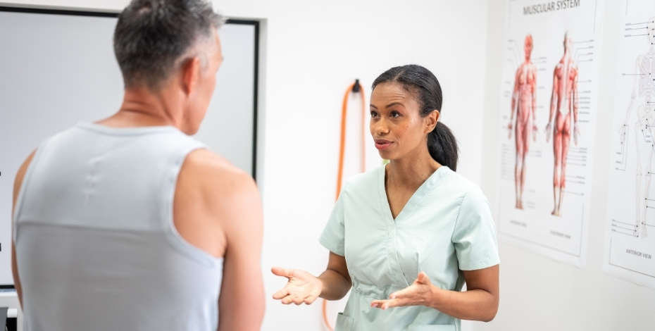 A physiotherapist talking to a patient. 