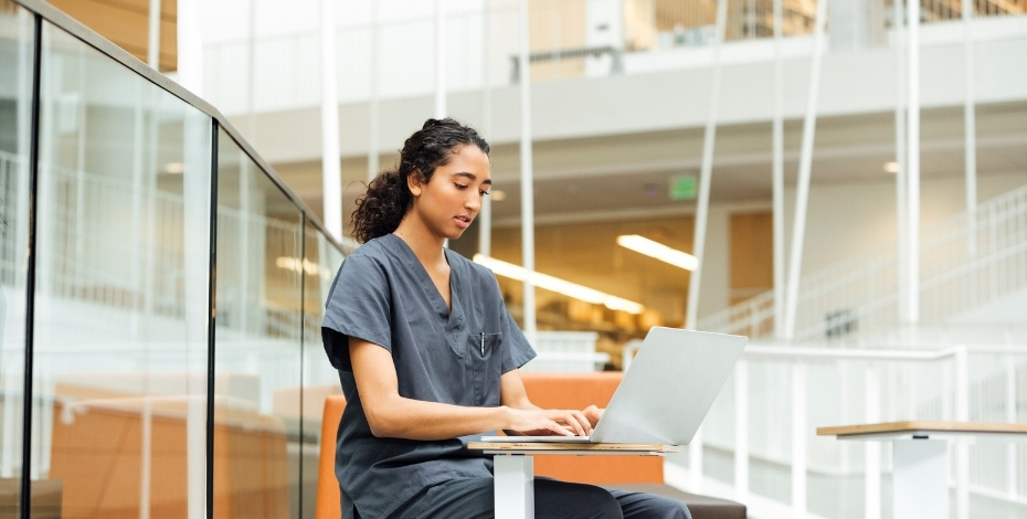 A physiotherapist working at her computer in the hospital.