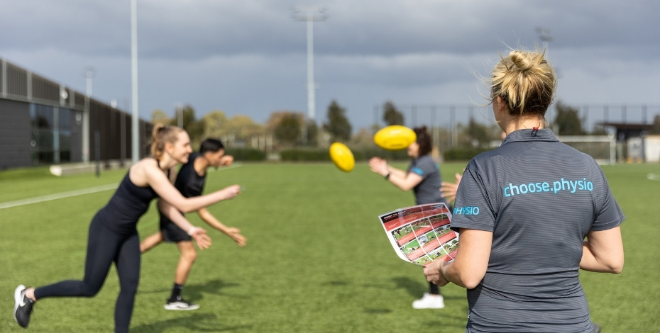 Physiotherapist training football coaches to deliver a structured warm-up