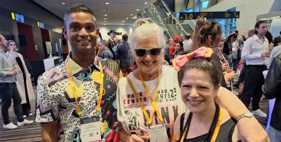 Ashan Weerakkody MACP with Professor Sheila Lennon and Dr Natalie Fini at the 1980s-themed closing dinner of the APASC25 national conference. 