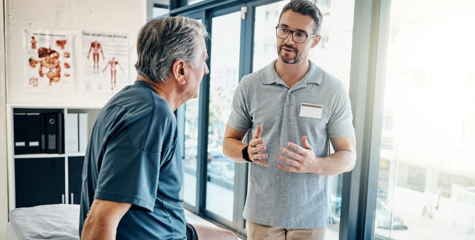 Physiotherapist talking with a patient