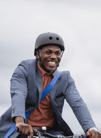 A man enjoys riding a bicycle