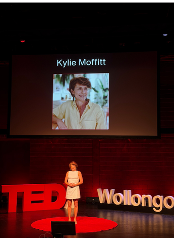 The photo is of physiotherapist Kylie Moffitt giving her TEDx talk
