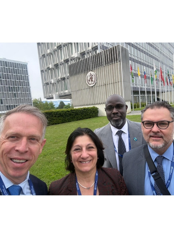 Pic of Rik Dawson outside the WHO headquarters in Geneva with French National Council of Physiotherapists President Pascale Mathieu, World Physiotherapy CEO Dr Sidy Dieye and World Physiotherapy President Mike Landry during the 79th World Health Assembly.