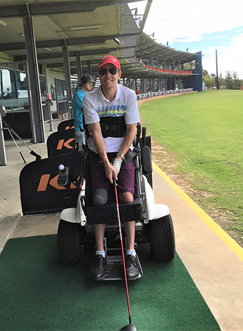 Using specialised equipment, Robert still enjoys getting out to the golf driving range when he can.