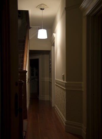 "dimly lit hallway"